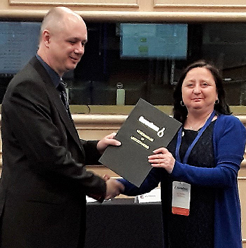 David Milde hands over to the new Chair, Marina Patriarca